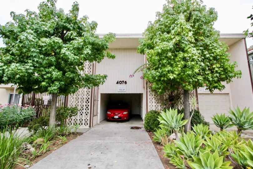 Car parking at the center of the house with plain elevation in Golden Oaks.
