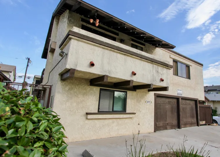 Two story residential building with attached garages at Golden Terrace in North Park California