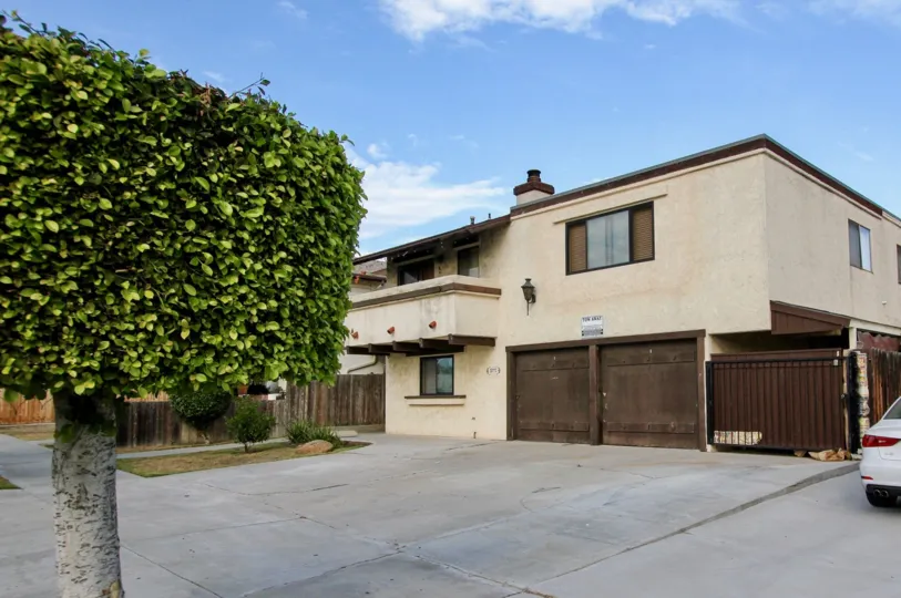 Driveway in front of residence with attached parking garages at Golden Terrace in North Park California