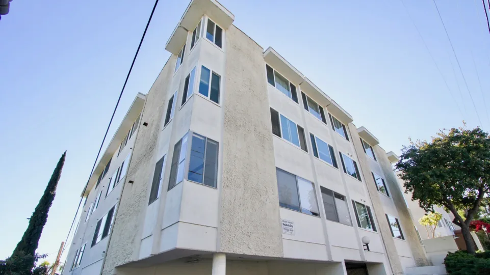 Upward view of Blue sky and the facade of the building Horizon House in North Park