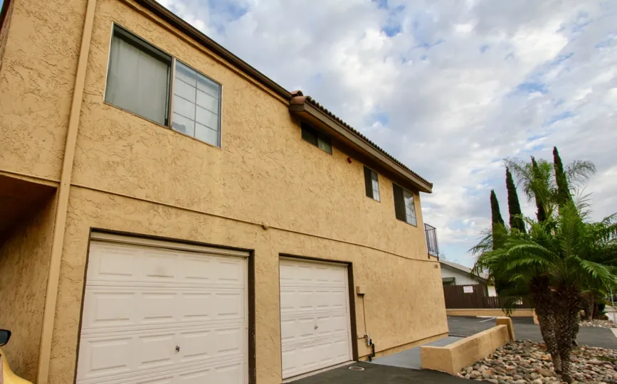The view of a garage on a cloudy day in the Horizon View community in North Park, California.
