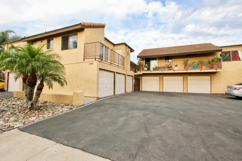 A sunny day in the area of Horizon View, gated entrance, warning signs, fence, parking lot