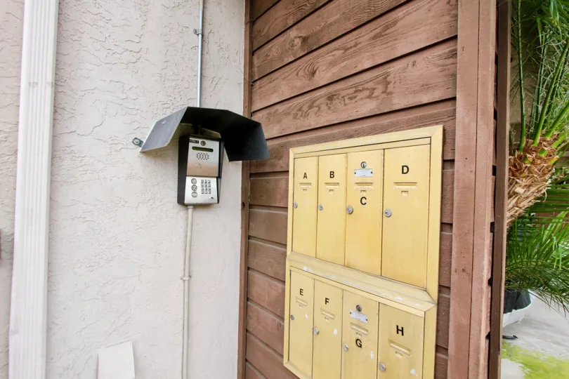 A black panel provides shade to a call box at Idaho Street condos