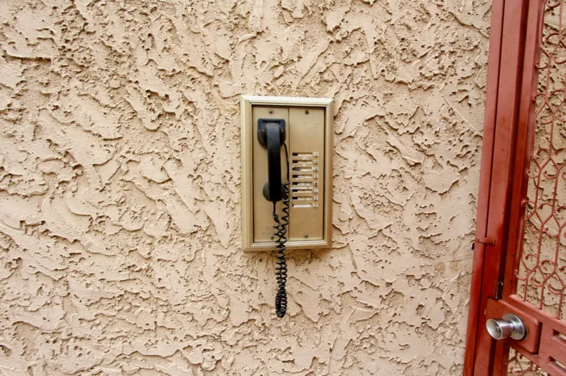 Textured wall with telephone in Illinois Park Condos North Park California.