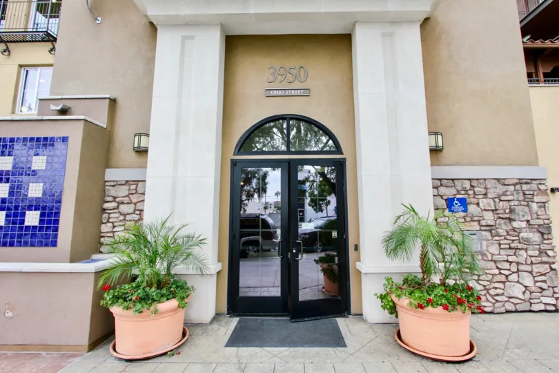 One mirrored door sits open on the front of the La Bohem condo building