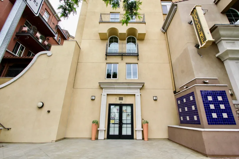 La Boheme , North Park ,California,dark cream building, arch. white square