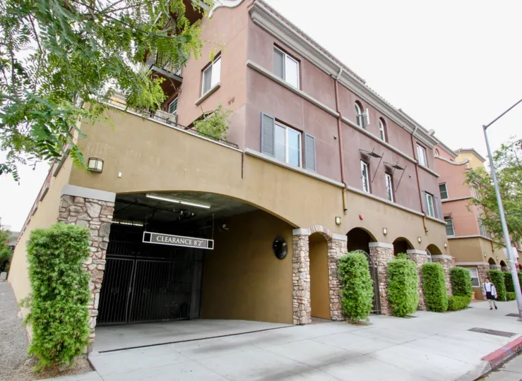 A sunny day in the area of La Boheme, apartment building, street, gate