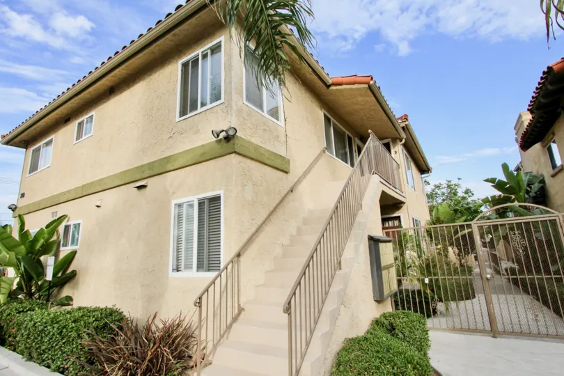 View of a residence with ladder and metalic door and plants in front in the La Hacienda