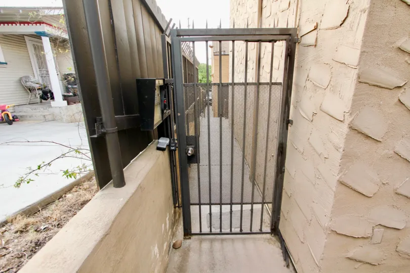 A metal gate secures this residence located in the Las Casitas community