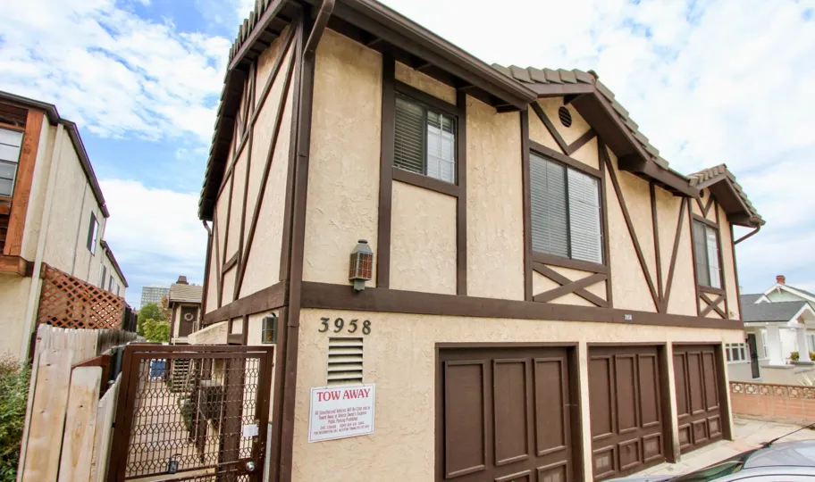 Two story residential buildings with attached garages at Louisiana Heights in North Park California