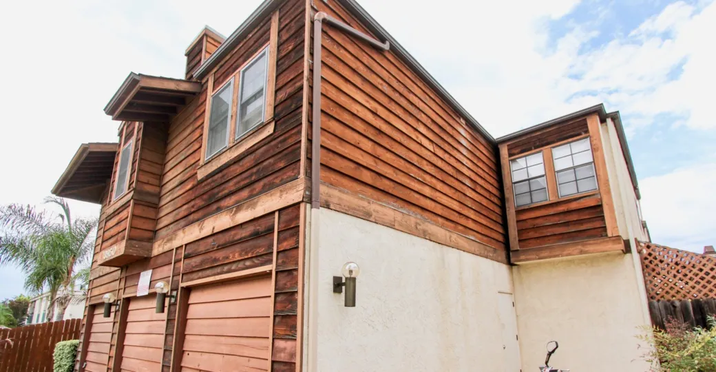A sunny day in the area of Louisiana Street, condos, garage, wood, windows
