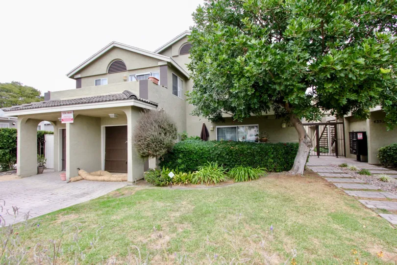 Housing with yard and walkway at Louisiana Village Bayside in North Park California