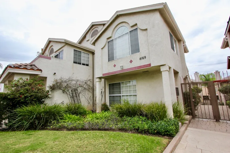 Mardi Gras Villas ,: North Park  , California, blue and white sky,lawn