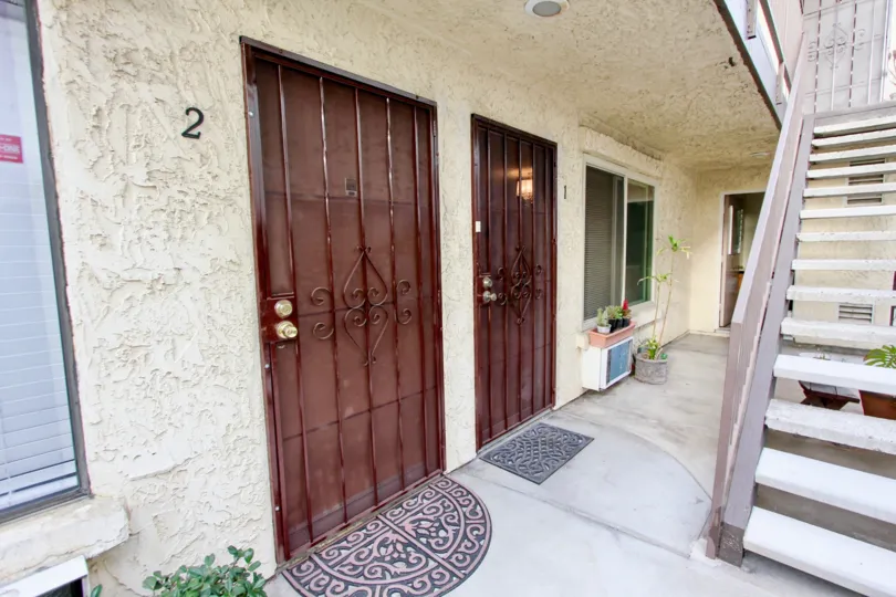 Doors of the NIle Street Condos with flower pots marked the house numbered with 2