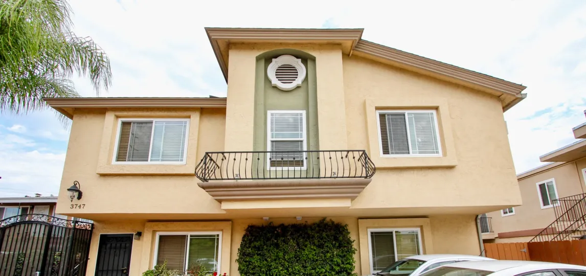 A sunny day in the area of North Park Villas, Condos, cars, gate, porch
