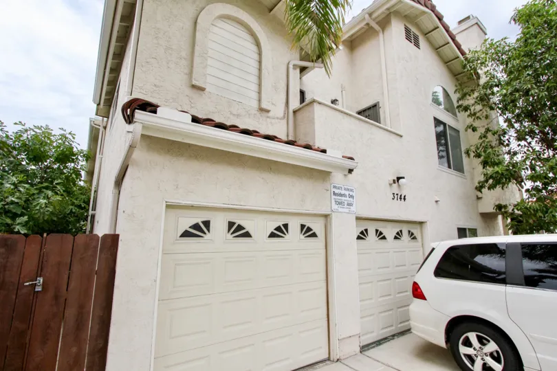 Omega II , North Park , California,off white building,white car