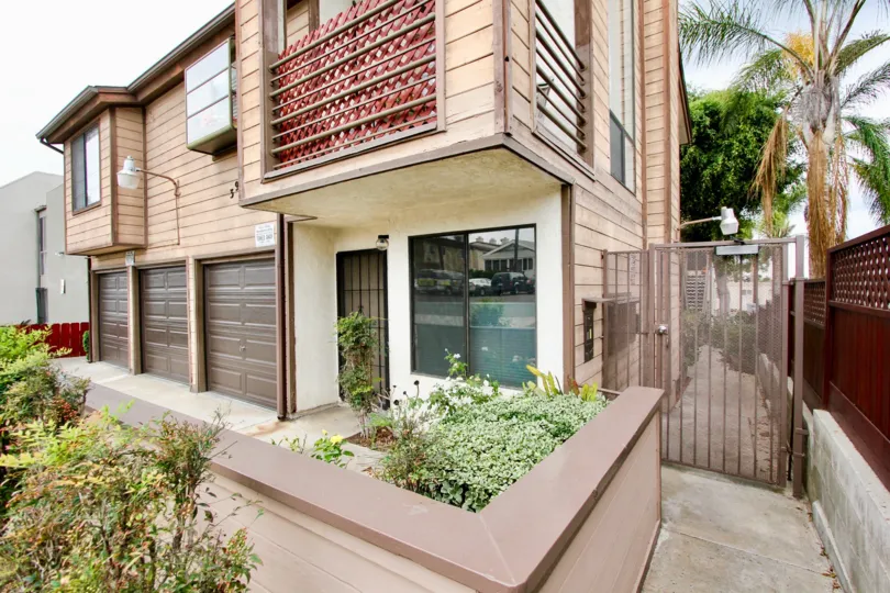 House in Oregon Court community in North Park, CA. Contains three garages.