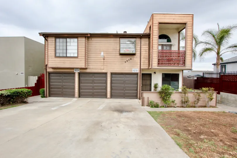 Two story residential building with attached garages at Oregon Court in North Park California