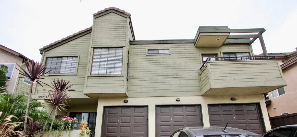 Olive painted three car garage home in Oregon Street North Park California