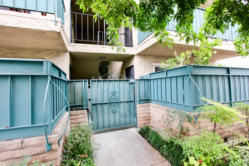 A sunny day in the area of Park Glen, condos, brick, bushes, balcony, window