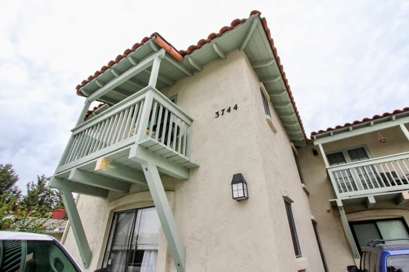 Park Heights Community North Park California balcony tile roof creme sliding glass doors windows trees outdoor lighting