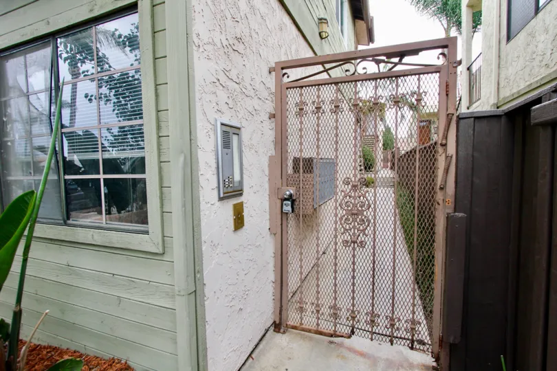 Park Village III  , North Park ,: California,brown grill gate, rough wall