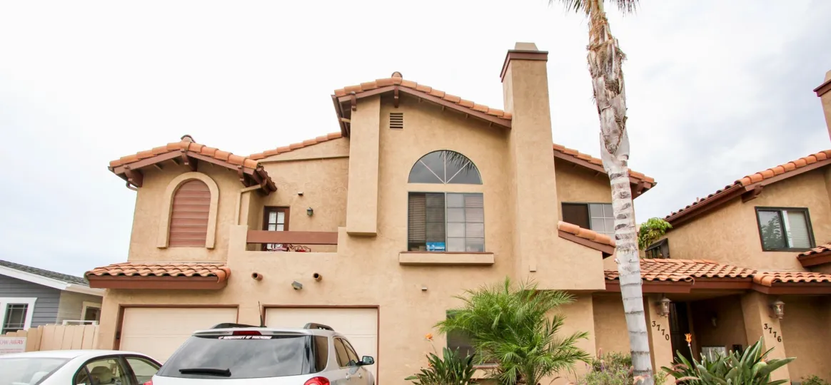 Pershing Park Villas  ,: North Park , California,beige building,tree bark