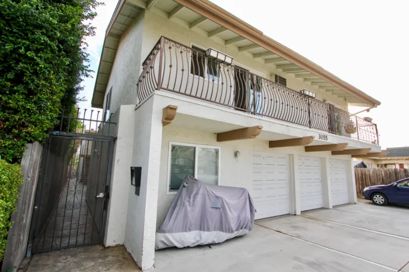 A sunny day in the area of South Park Villas, parking lot, garage, car, gated entrance