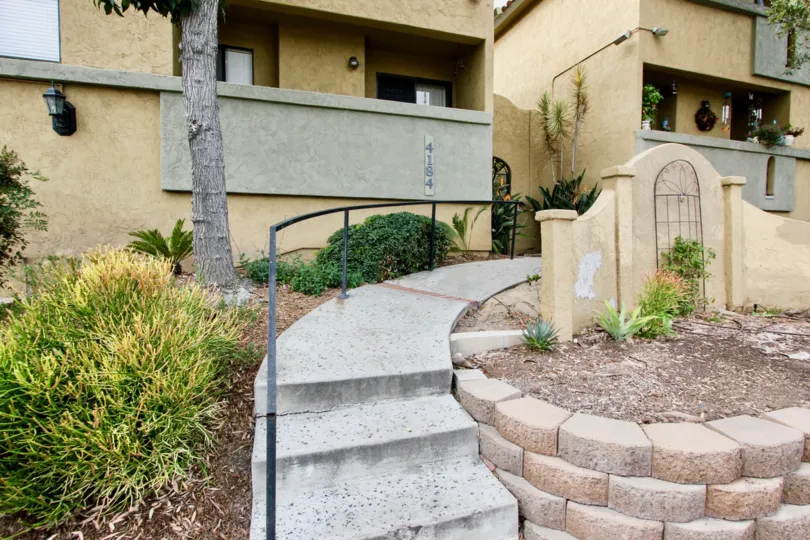 A sunny day in the area of Spanish Oaks I, walkway, stairs, railing, condos
