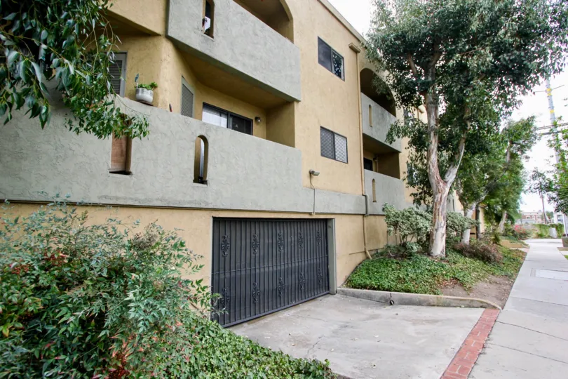 Front yard and facade and garage entrance at Spanish Oaks in North Park, CA