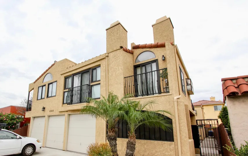 Large, beautifully built Spanish style home in North Park California with palm trees