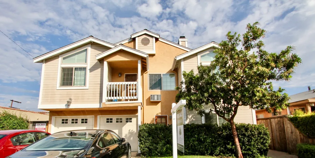 green tree houses and cars in North Park, California