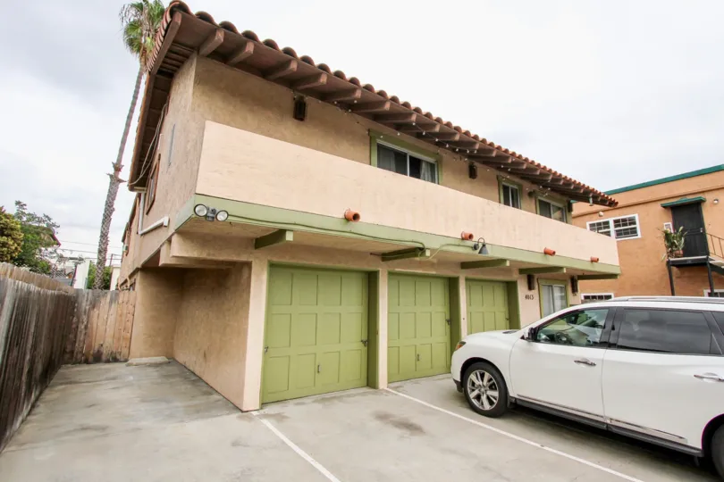 Parked car in front of a residential building at Texas Street Condos in Nort Park California