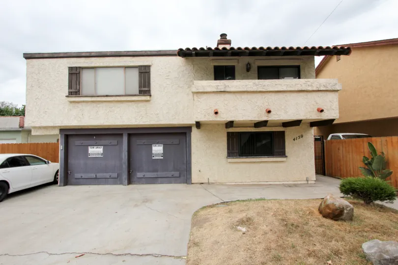 A view of the front balcony and driveway area of The Alamo apartments in North Park, CA.