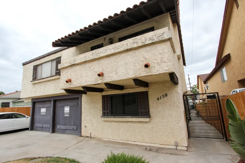 A sunny day in the area of The Alamo, condo, gated entrance, garage, car