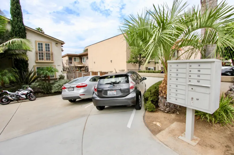2 parked cars, a motorcycle and postboxes in The Garden District, North Park, California
