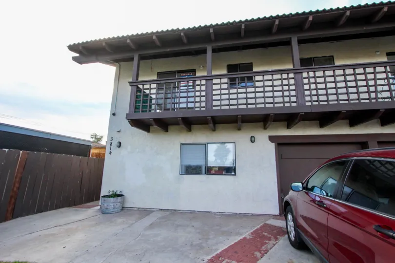 Driveway and garage in front of a residential building at Triton Condos in North Park California