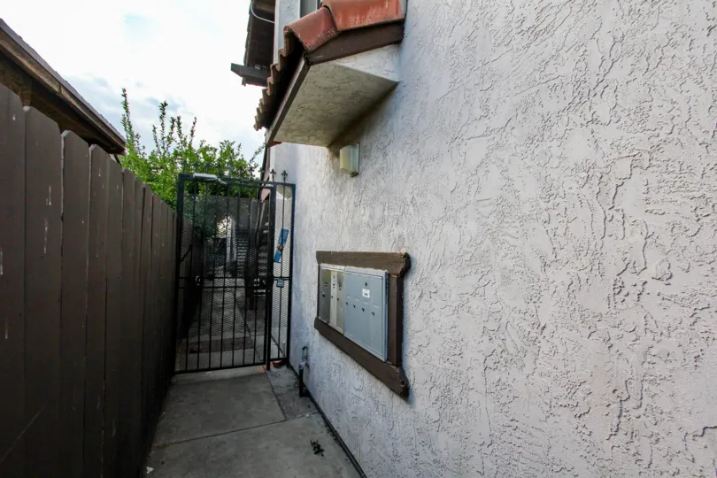 walkway and mailboxes on stucco wall at Triton Condos in North Park, California
