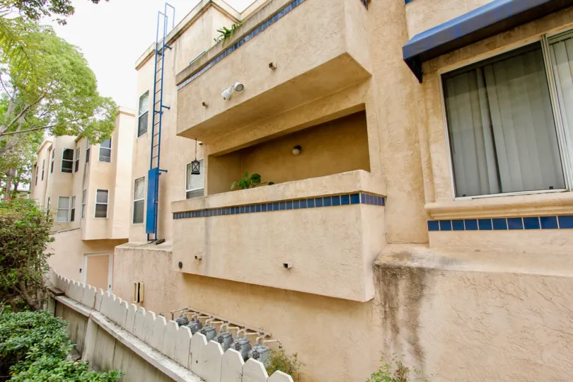A water stain sits below a window at the Uptown Villas condos.