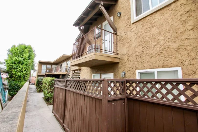 The side of an apartment showcasing a balcony in the Utah Street Condos