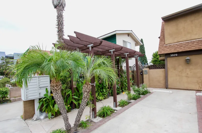 Utah Street Condos in North Park, California bring peaceful nature to you as you walk underneath a wooden awning surrounded by plants to get to your humble abode.