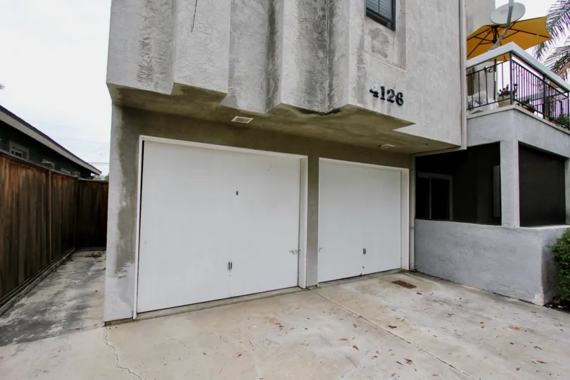 Front of house with two garage doors and pation in up in the Utah Villa
