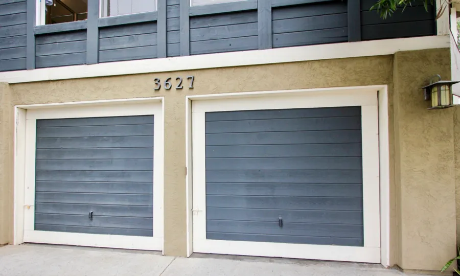 A sunny day in the area of Victorian House IV, parking lot, garage, windows