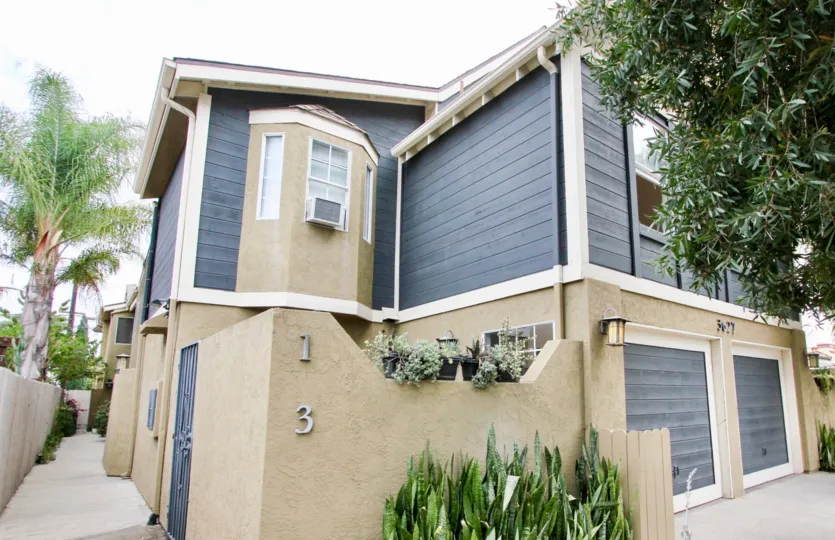 Victorian House VI community North Park California blue bay windows garage courtyard landscaping gate