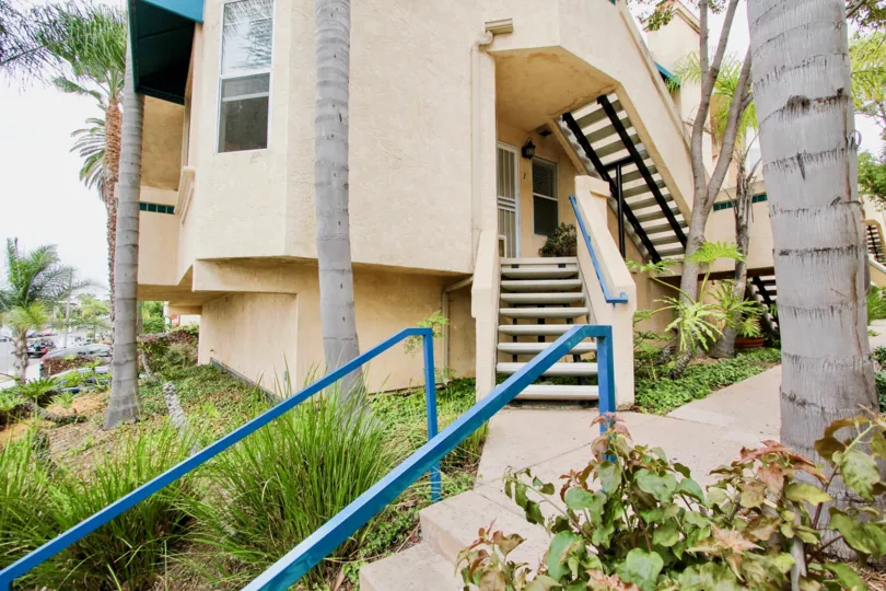 A stairway entrance and outside view of an apartment complex in Villa Del Rio neighborhood in North Park, California