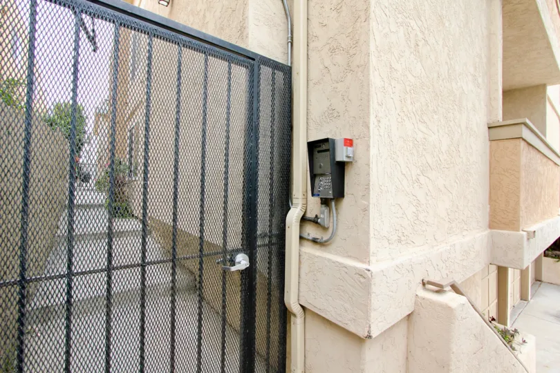 The outside of this village Terrace condo showing the gated community and call system.
