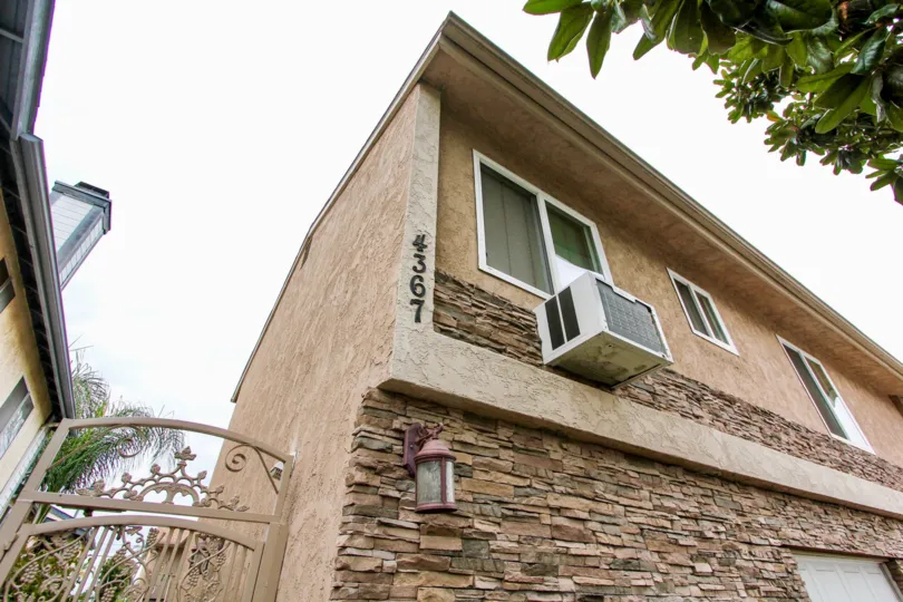 A sunny day in the area of Villas on Idaho, gated entrance, air conditioner, window