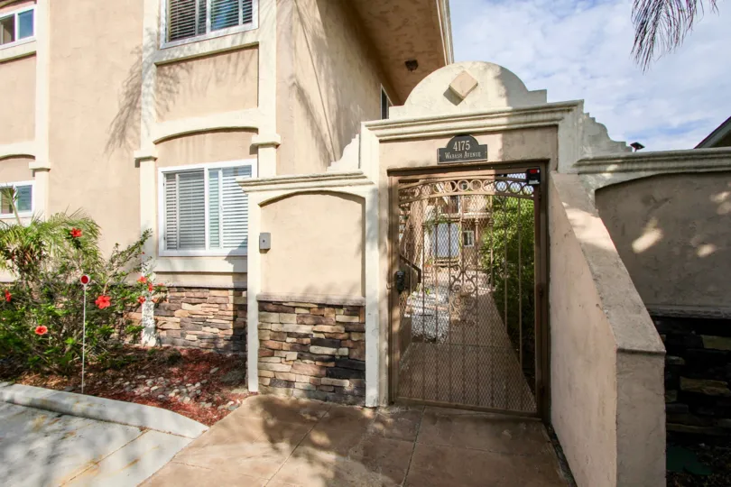 Stone formed decoration wall with small gate in Wabash Gardens.