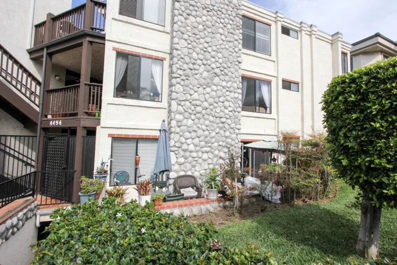 A three-storey house with a garden in the Bay Point community.