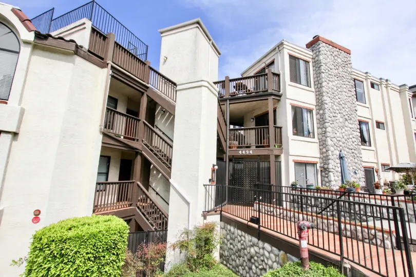 Stairs and building of Bay Point apartment complex in a bright sunny day